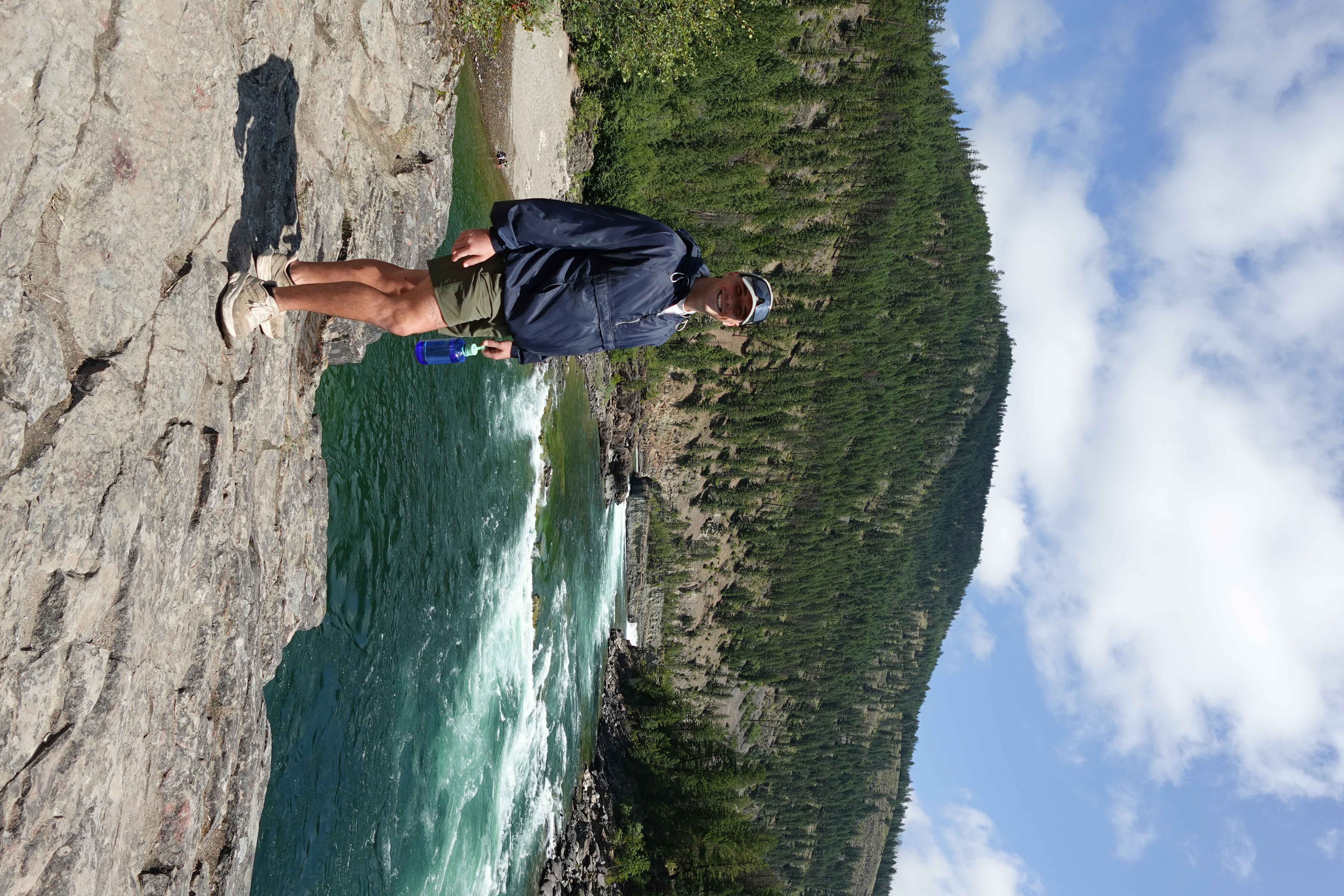 Josh, founder of Aaron Meadow Marketing, outdoors by a river